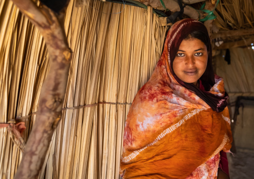 Portrait of a tuareg young woman in a reed house, North Africa, Tamanrasset, Algeria