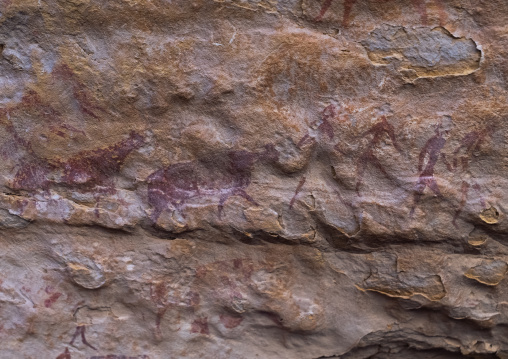 Rock painting depicting men and cows, Tassili N'Ajjer National Park, Tadrart Rouge, Algeria