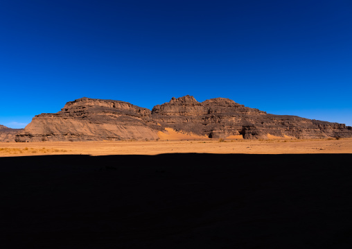 Rocks and sand dunes in Sahara desert, Tassili N'Ajjer National Park, Tadrart Rouge, Algeria