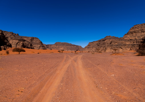 Rocks and sand dunes in Sahara desert, Tassili N'Ajjer National Park, Tadrart Rouge, Algeria