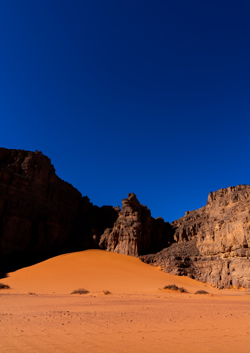 Rocks and sand dunes in Sahara desert, Tassili N'Ajjer National Park, Tadrart Rouge, Algeria