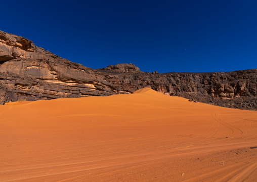 Rocks and sand dunes in Sahara desert, Tassili N'Ajjer National Park, Tadrart Rouge, Algeria