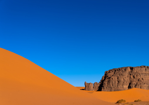 Rocks and sand dunes in Sahara desert, Tassili N'Ajjer National Park, Tadrart Rouge, Algeria