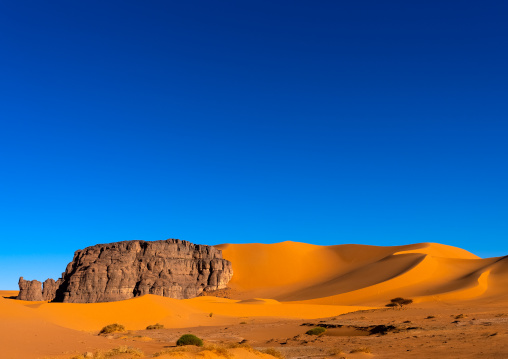 Rocks and sand dunes in Sahara desert, Tassili N'Ajjer National Park, Tadrart Rouge, Algeria