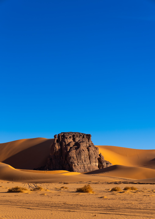 Rocks and sand dunes in Sahara desert, Tassili N'Ajjer National Park, Tadrart Rouge, Algeria