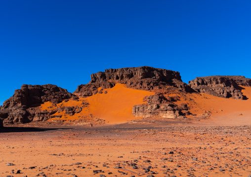 Rocks and sand dunes in Sahara desert, Tassili N'Ajjer National Park, Tadrart Rouge, Algeria