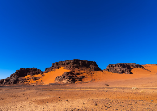 Rocks and sand dunes in Sahara desert, Tassili N'Ajjer National Park, Tadrart Rouge, Algeria