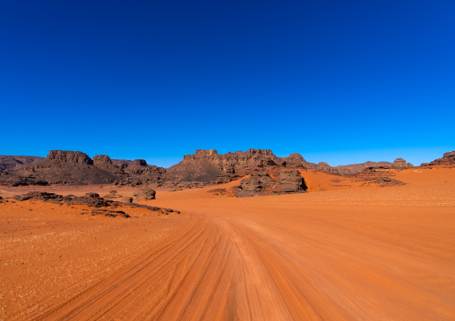 Rocks and sand dunes in Sahara desert, Tassili N'Ajjer National Park, Tadrart Rouge, Algeria