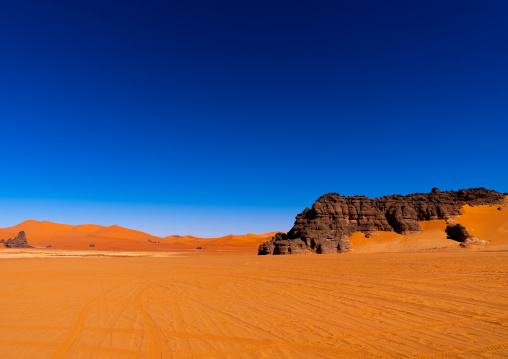 Rocks and sand dunes in Sahara desert, Tassili N'Ajjer National Park, Tadrart Rouge, Algeria