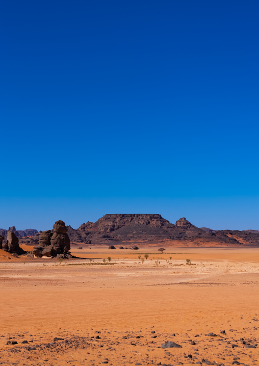 Rocks and sand dunes in Sahara desert, Tassili N'Ajjer National Park, Tadrart Rouge, Algeria