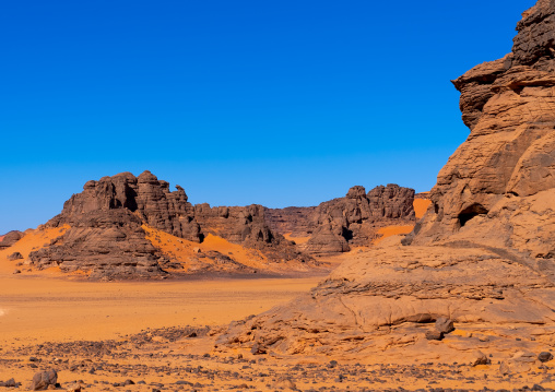 Rocks and sand dunes in Sahara desert, Tassili N'Ajjer National Park, Tadrart Rouge, Algeria