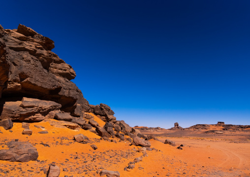 Rocks and sand dunes in Sahara desert, Tassili N'Ajjer National Park, Tadrart Rouge, Algeria