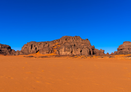 Rocks and sand dunes in Sahara desert, Tassili N'Ajjer National Park, Tadrart Rouge, Algeria