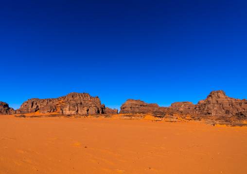 Rocks and sand dunes in Sahara desert, Tassili N'Ajjer National Park, Tadrart Rouge, Algeria