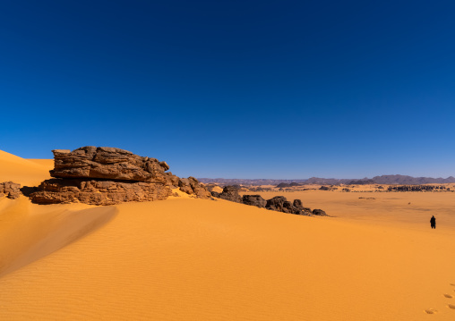 Rocks and sand dunes in Sahara desert, North Africa, Erg Admer, Algeria