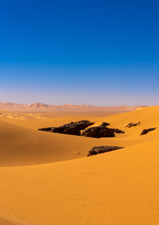 Rocks and sand dunes in Sahara desert, North Africa, Erg Admer, Algeria