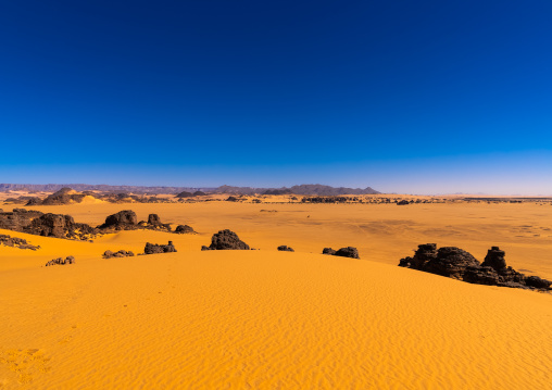 Rocks and sand dunes in Sahara desert, North Africa, Erg Admer, Algeria