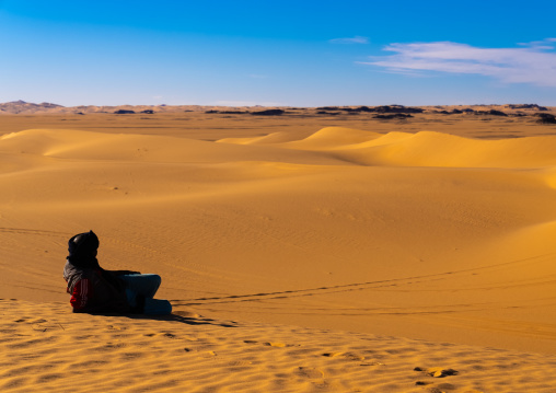 Tuareg in the sand dunes in Sahara desert, North Africa, Erg Admer, Algeria