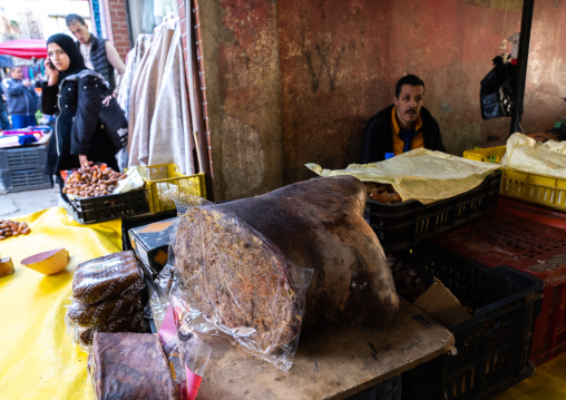 Algerian man selling dates packed in an animal skin, North Africa, Constantine, Algeria