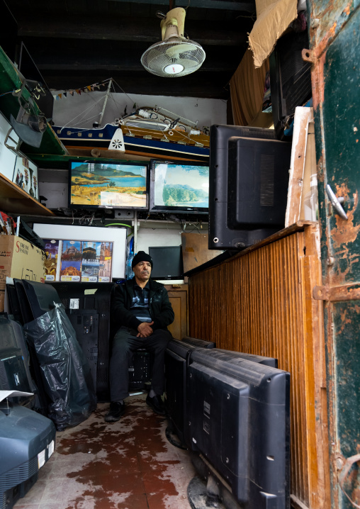 Algerian man selling televisions in the Casbah, North Africa, Algiers, Algeria