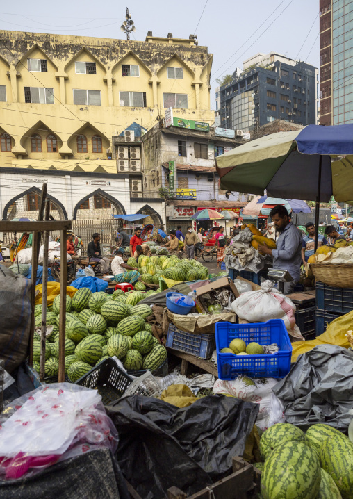 Bangladeshi man selling watermelons at Kawran Bazar market, Dhaka Division, Dhaka, Bangladesh