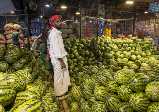 Bangladeshi man selling watermelons at Kawran Bazar market, Dhaka Division, Dhaka, Bangladesh