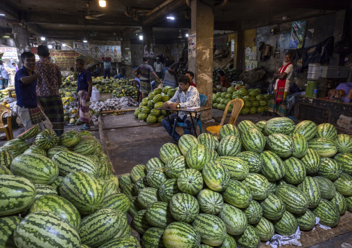 Bangladeshi man selling watermelons at Kawran Bazar market, Dhaka Division, Dhaka, Bangladesh