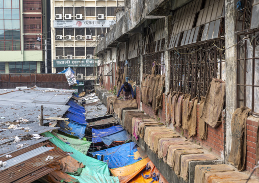 Bangladeshi men drying burlap sacks in Kawran bazar, Dhaka Division, Dhaka, Bangladesh