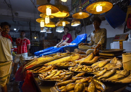 Bangladeshi man selling fresh fish at fish market, Dhaka Division, Dhaka, Bangladesh