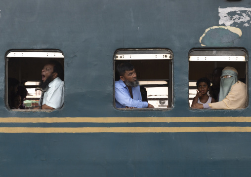 Passengers in a train passing in Kawran bazar, Dhaka Division, Dhaka, Bangladesh