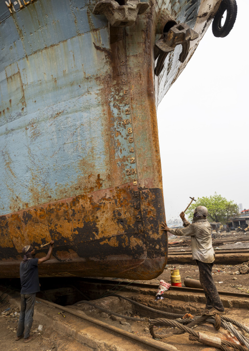 Workers at Dhaka Shipyard removing rust, Dhaka Division, Keraniganj, Bangladesh