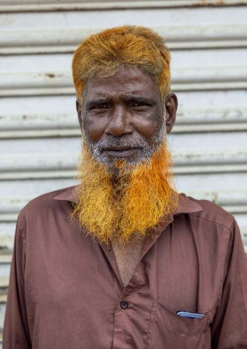 Portrait of a bangladeshi man with beard and hair dyed in henna, Dhaka Division, Keraniganj, Bangladesh