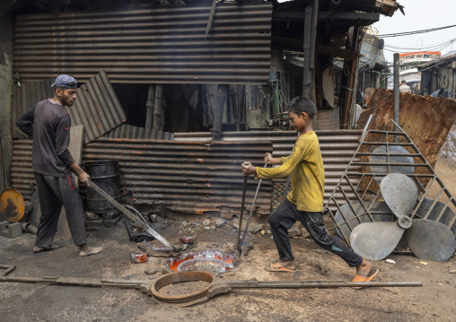 Bangladeshi workers melting steel at Dhaka Shipyard, Dhaka Division, Keraniganj, Bangladesh