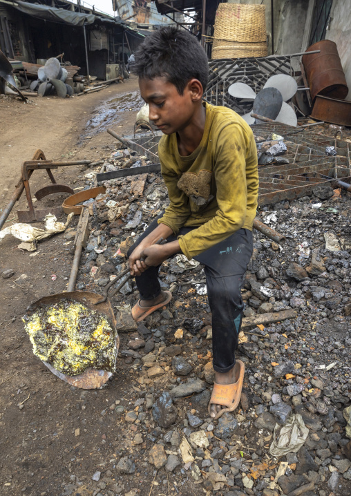 Bangladeshi boy melting steel at Dhaka Shipyard, Dhaka Division, Keraniganj, Bangladesh