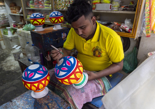 Bangladeshi hindu man painting a pot, Dhaka Division, Dhaka, Bangladesh