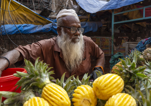 Bangladeshi old man selling pineappeles, Dhaka Division, Dhaka, Bangladesh