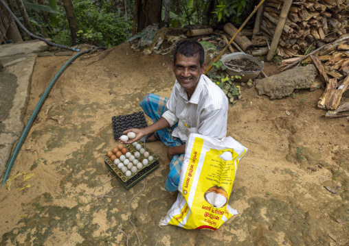 Smiling Khasi tribe man selling eggs, Sylhet Division, Kamalganj, Bangladesh