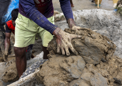 Workers digging clay in a brick factory, Sylhet Division, Bahubal, Bangladesh