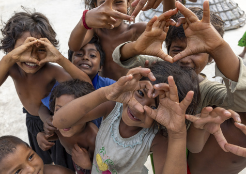 Bangladeshi children forming hands hearts, Chittagong Division, Ashuganj, Bangladesh