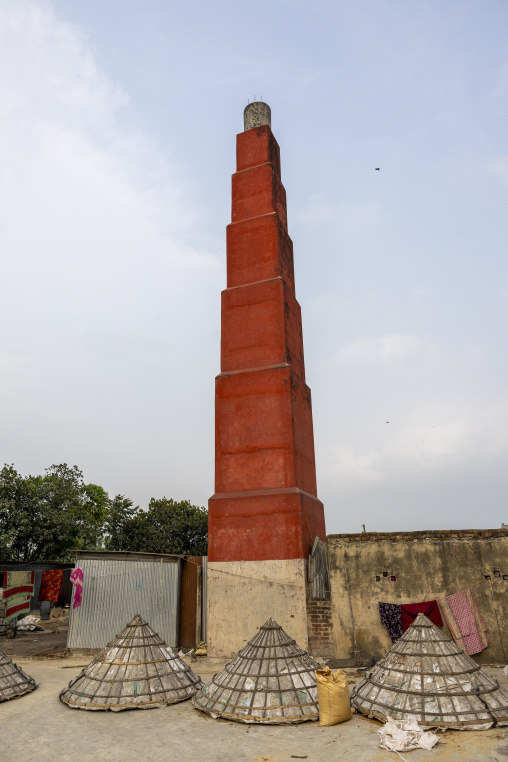 Mounds of rice with giant hat-shaped bamboo cones and chimney, Chittagong Division, Ashuganj, Bangladesh