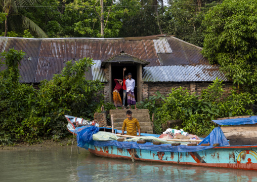 House and local boat, Barisal Division, Banaripara, Bangladesh