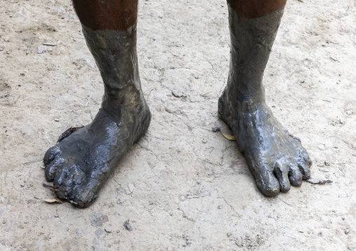 Muddy feet of a bangladeshi fisherman back from the mangrove, Khulna Division, Shyamnagar, Bangladesh