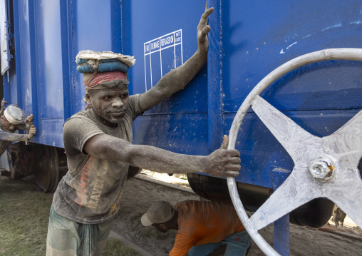 Bangladeshi workers pushing a blue train, Khulna Division, Abhaynagar, Bangladesh