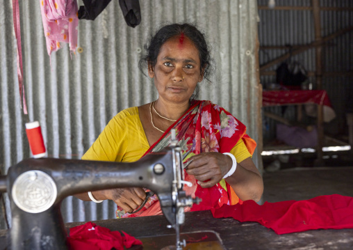 Woman working on a sewing machine, Khulna Division, Narail Sadar, Bangladesh