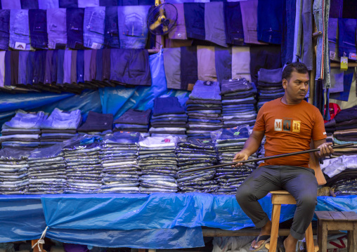 Portrait of a bangladeshi man selling blue jeans, Khulna Division, Jessore, Bangladesh