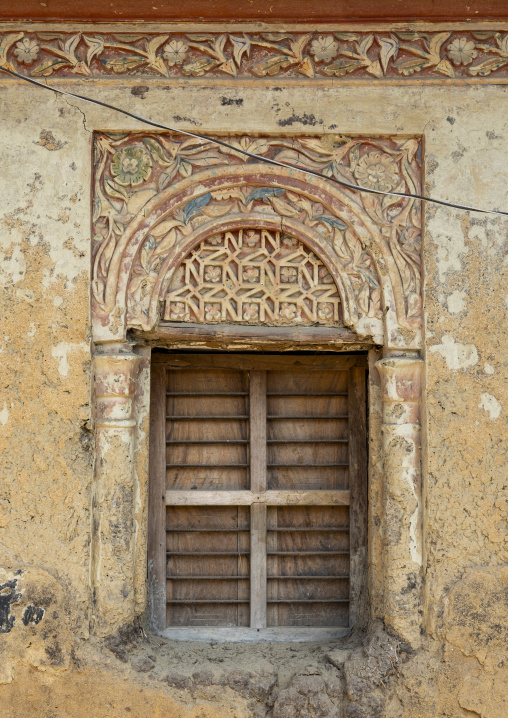 Window with plasterwork decorations in an old house, Rajshahi Division, Manda, Bangladesh