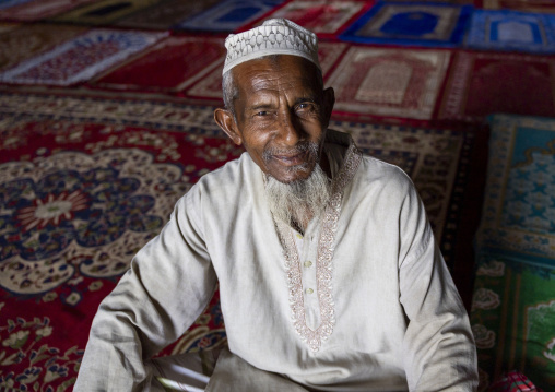 Bangladeshi muslim man with a white beard inside Kusumba mosque, Naogaon District, Manda Upazila, Bangladesh