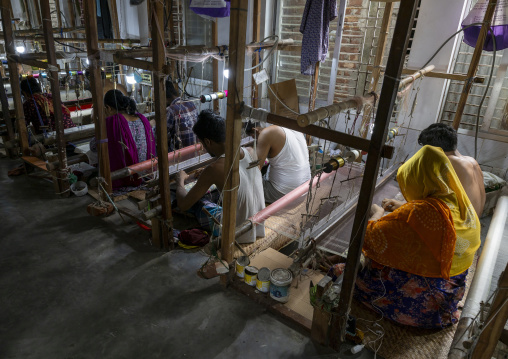 Bangladeshi people weaving in a sari factory, Dhaka Division, Rupganj, Bangladesh