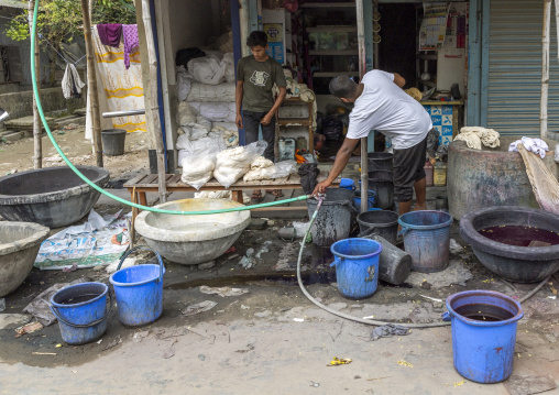 Bangladeshi men dyeing fabrics, Dhaka Division, Rupganj, Bangladesh