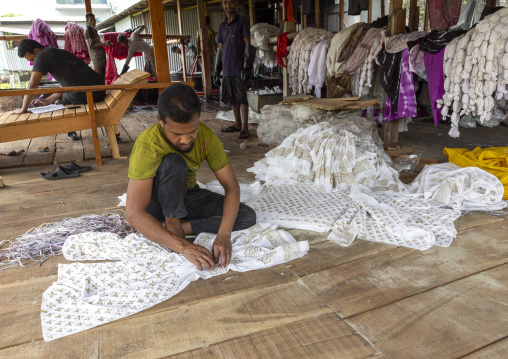 Bangladeshi man working in a batik factory, Dhaka Division, Rupganj, Bangladesh